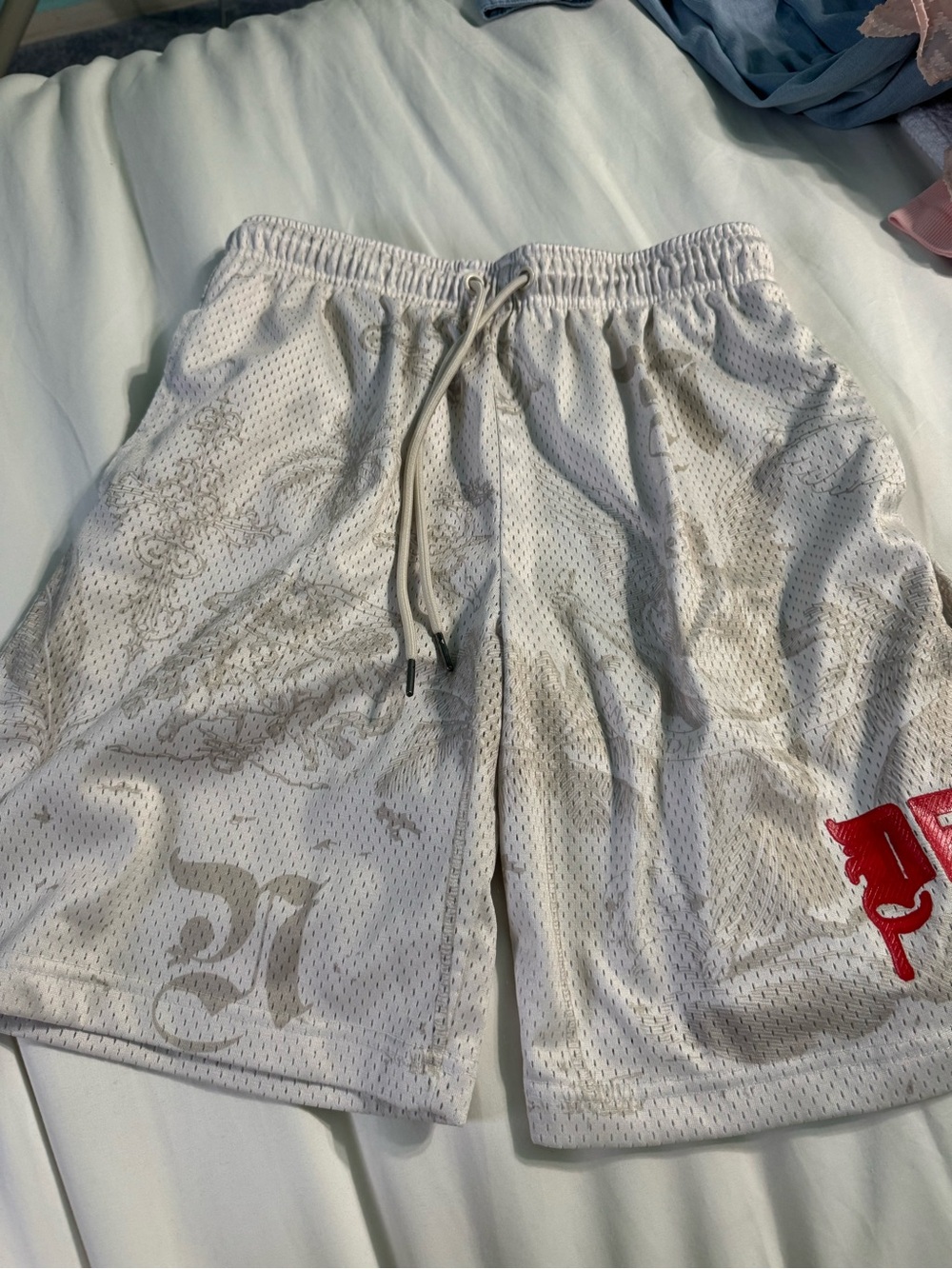 Men's White Mesh Athletic Shorts with Subtle Print and Red Accent